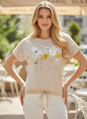 Dámske béžové tričko s kvetinovou potlačou.