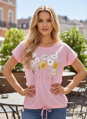 Dámske ružové tričko s kvetinovou potlačou.