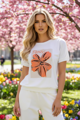 Dámske bavlnené tričko Megi Collection biele s oranžovým motívom veľkého kvetu.
