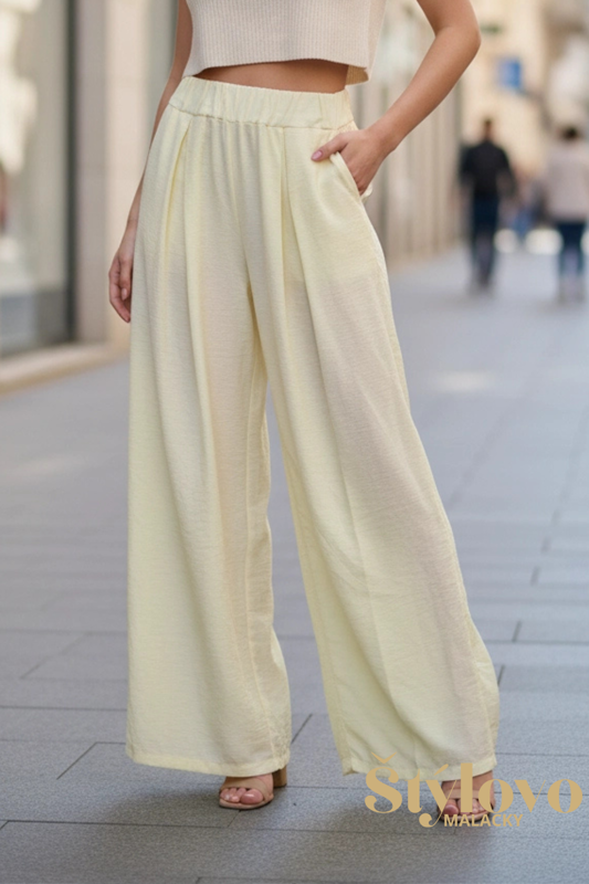 Dámske široké nohavice na gumu žlté.