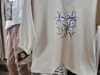 Dámske bavlnené tričko Megi Collection čierne s kvetmi.